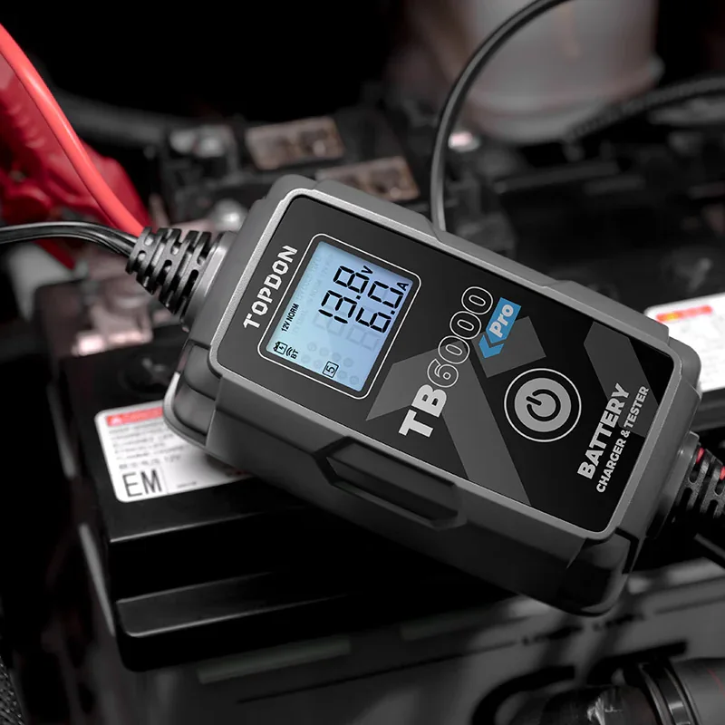TOPDON TB6000 Pro smart battery charger and tester connected in an engine bay