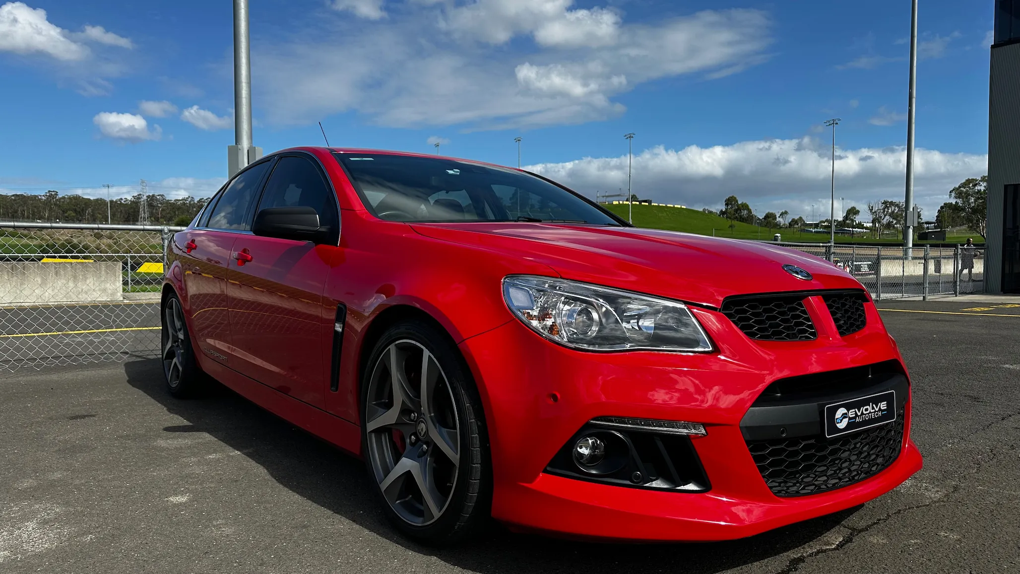 Red Holden VF Commodore (HSV Clubsport), front three-quarter view